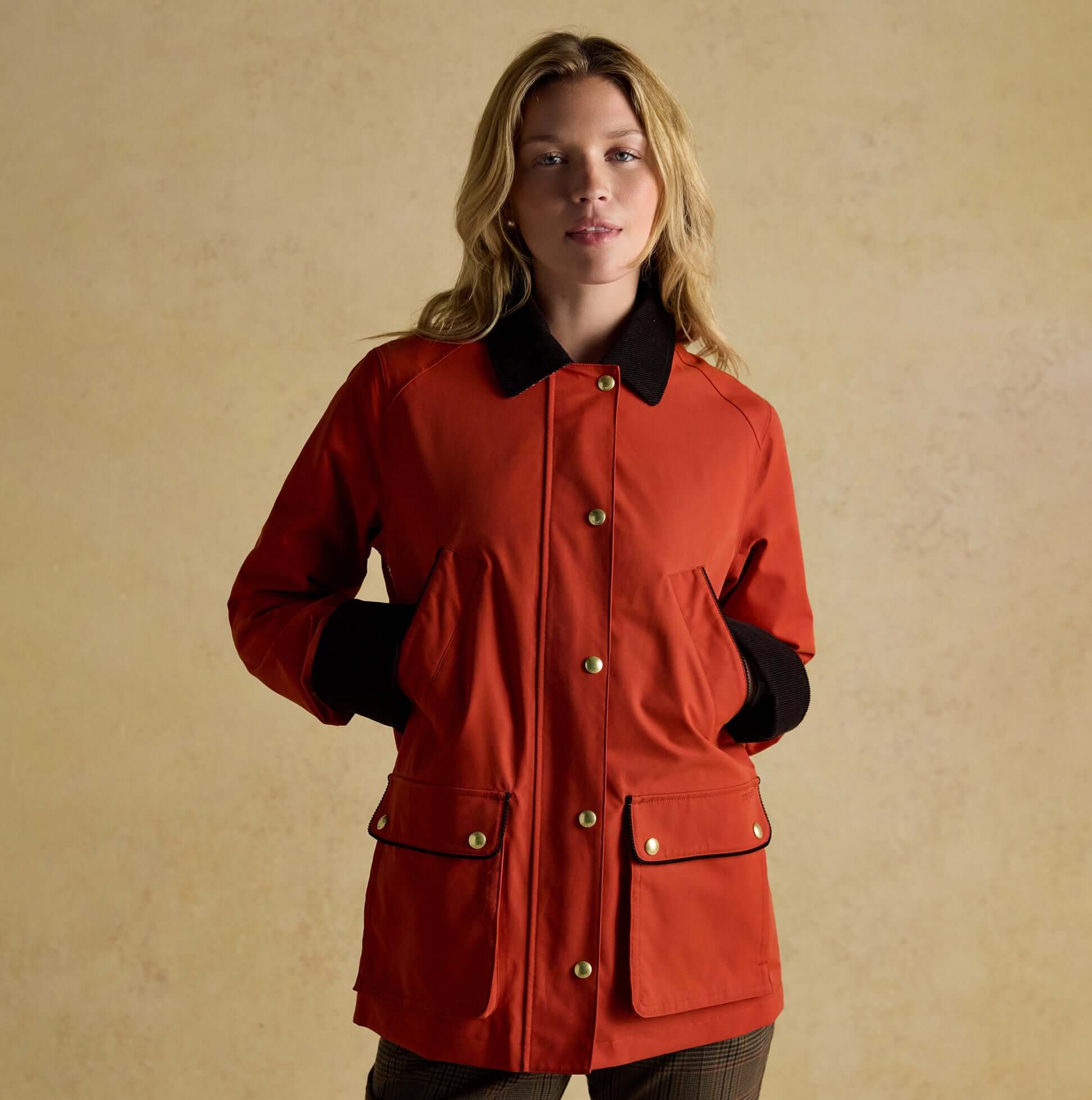 Joules KATHERINE Waterproof Heritage Coat Burnt Orange front view with button closure and side pockets.