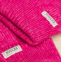 Joules ROSA Womens Gloves Pink detail view showing vibrant pink texture and brand tags.