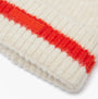Joules POPLEY STRIPE Womens Beanie Orange/Neutral detail view showcasing the ribbed texture and logo on the vibrant orange stripe.