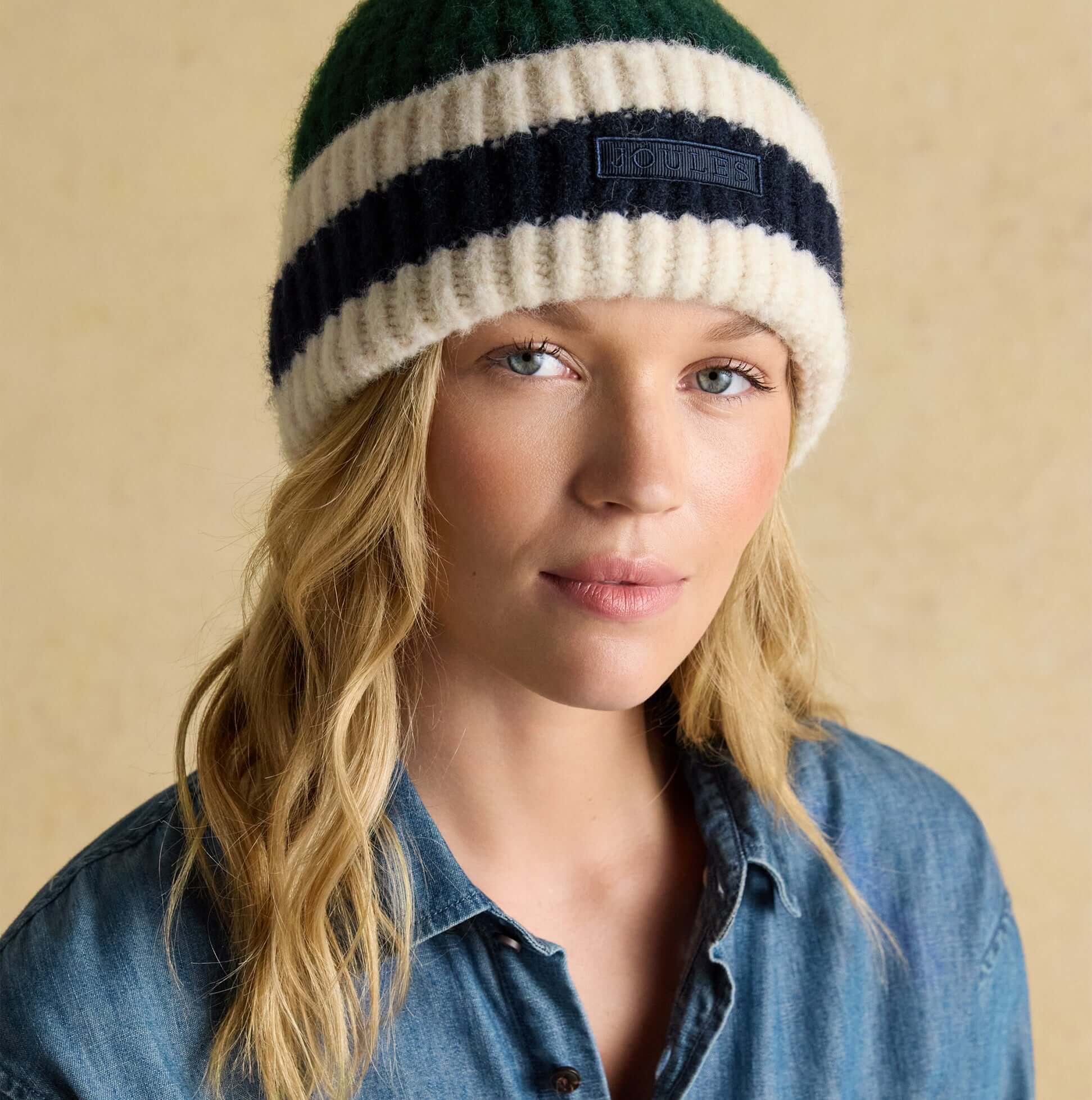 Joules POPLEY STRIPE Womens Beanie Green/Blue front view on model with light background.
