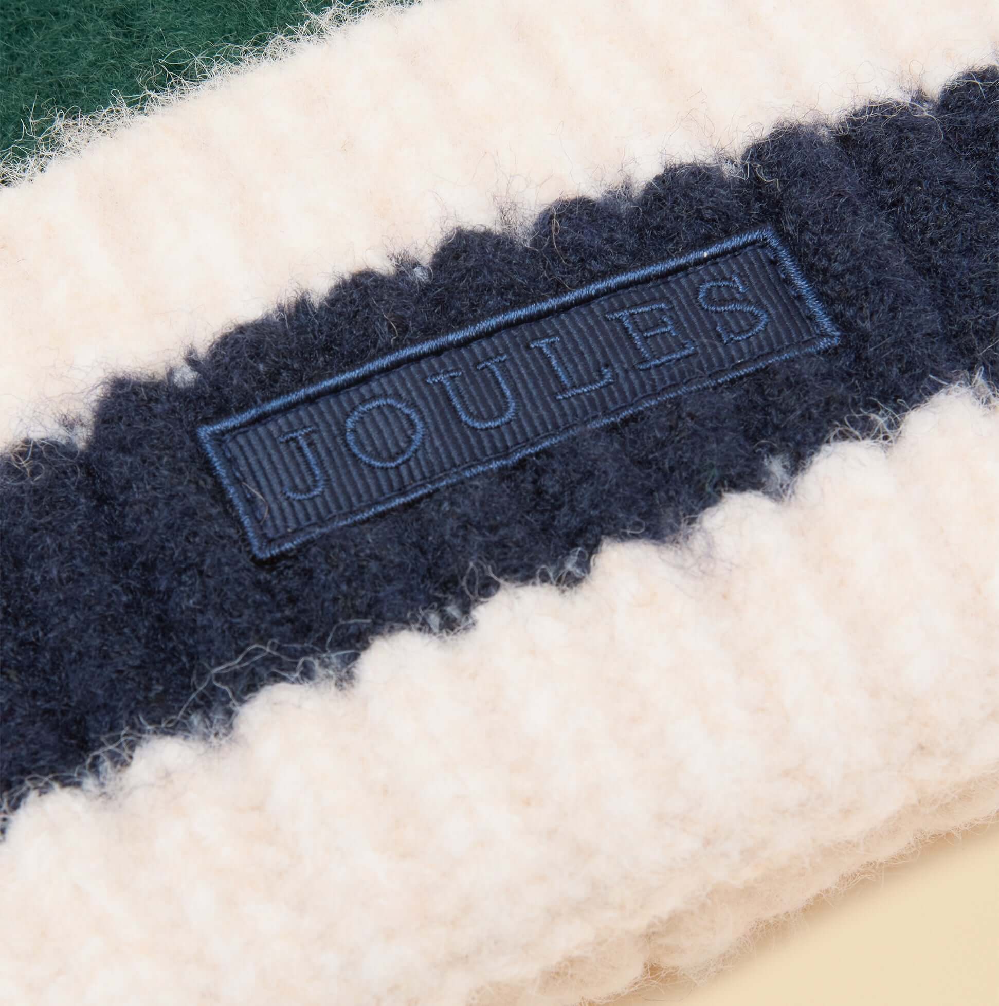 Joules POPLEY STRIPE Womens Beanie Green/Blue detail view showing the fabric texture and label.