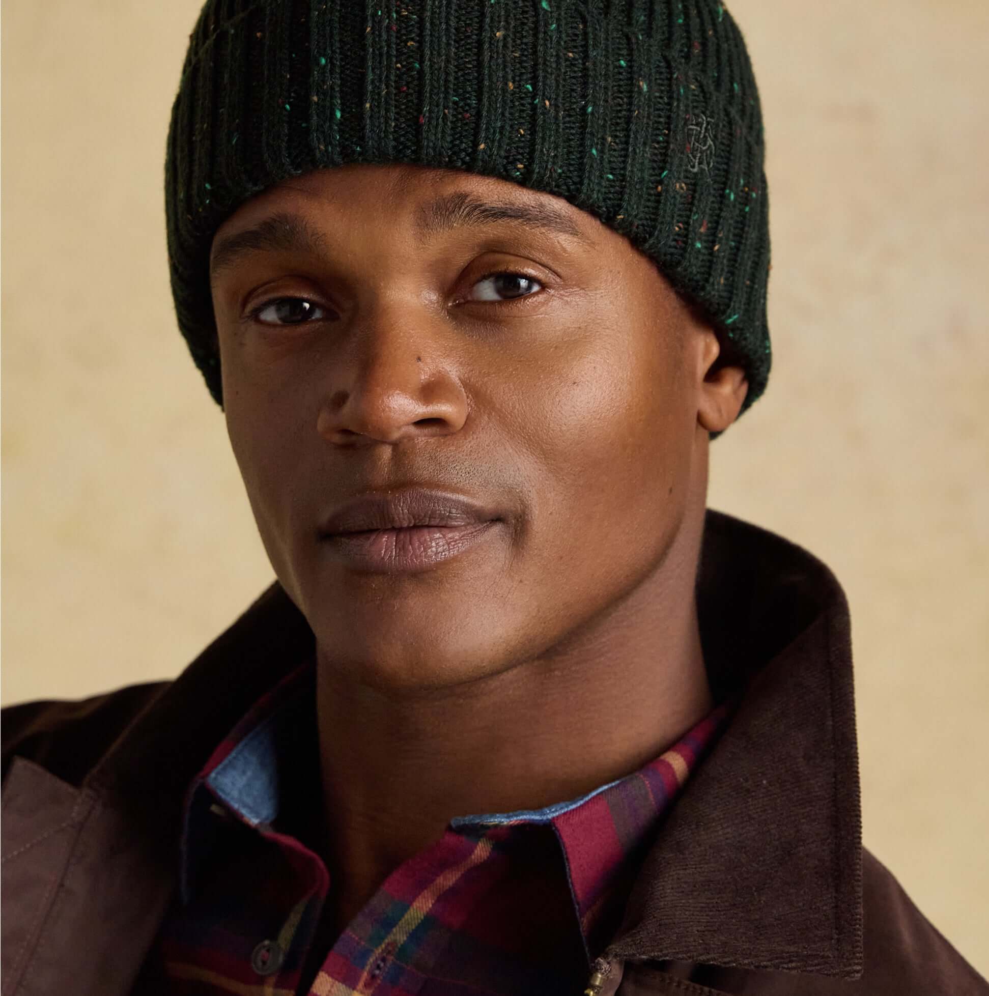 Joules HAMMOND Mens Beanie Green worn by a model, close-up front view, showing texture and color.