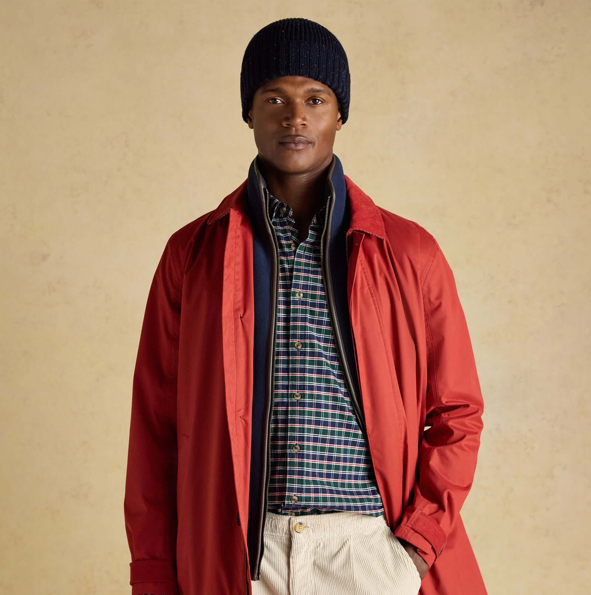 Joules HAMMOND Mens Beanie Navy worn by model in front view, styled with red coat and plaid shirt.