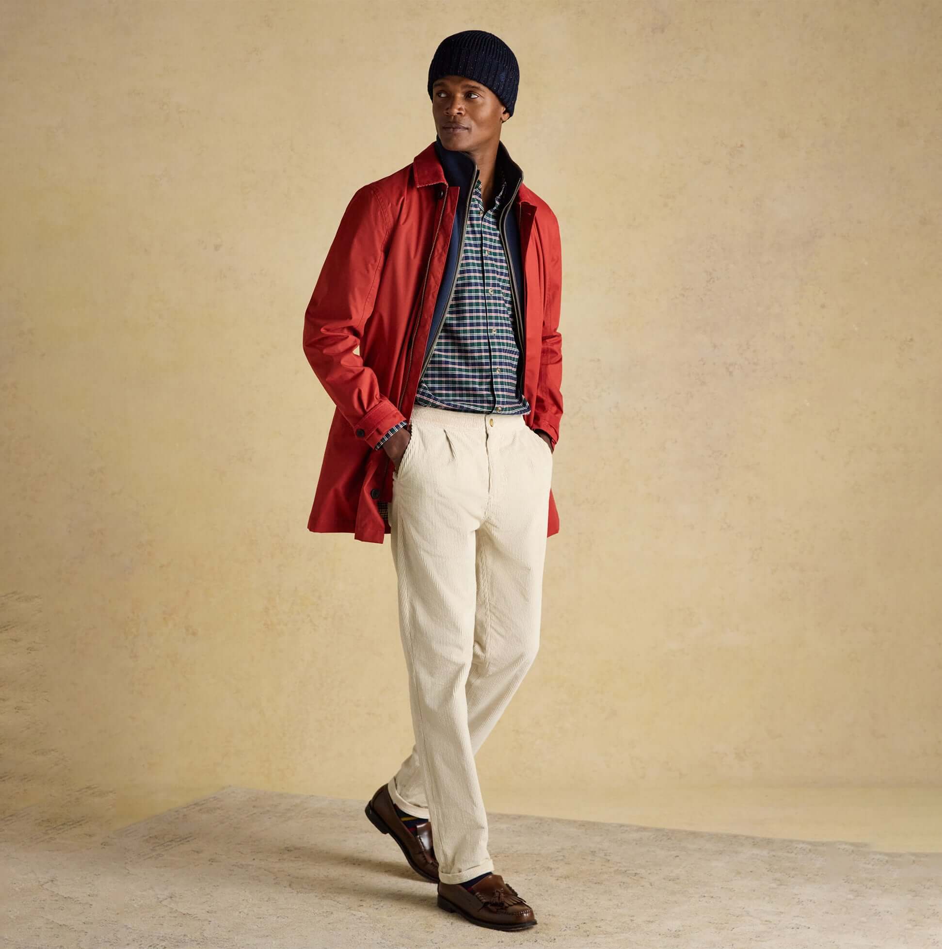 Joules HAMMOND Mens Beanie Navy side view worn by model with red coat and checkered shirt.