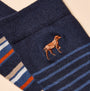 Joules KINGSBURY Mens Socks Navy/Ginger close-up detail view featuring dog embroidery design on dark navy background.