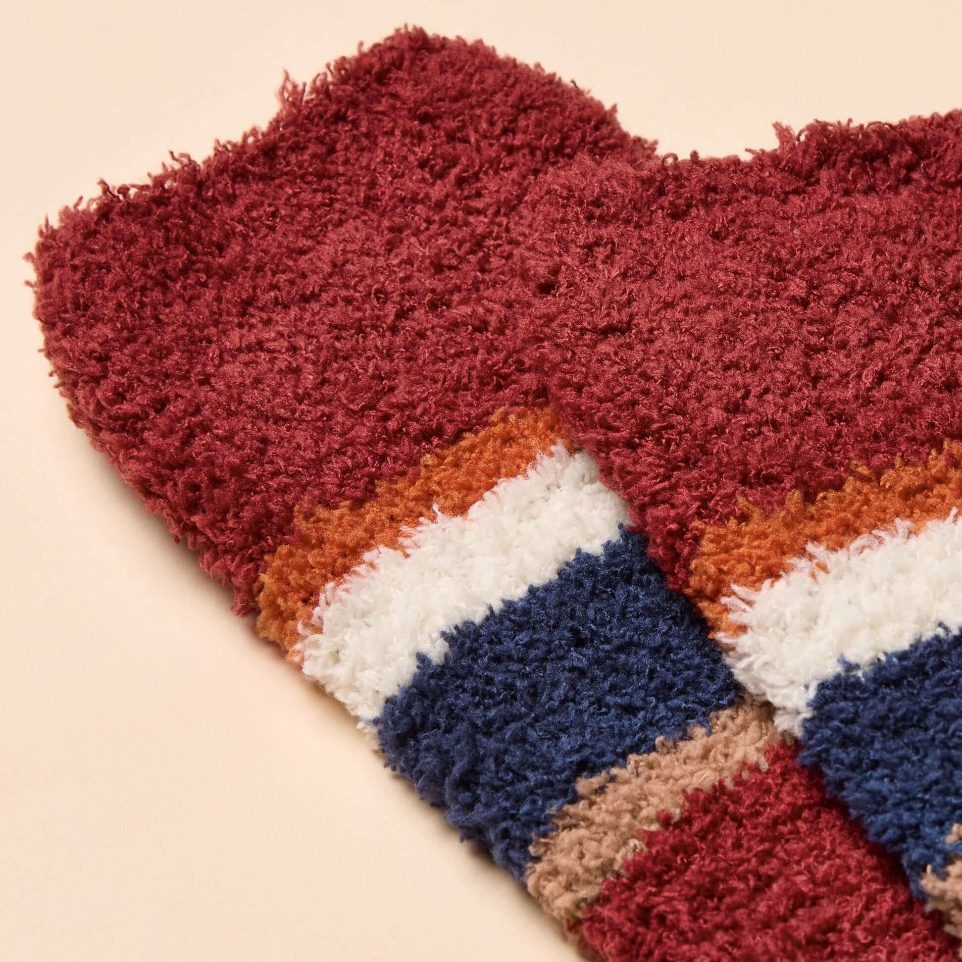Joules FLUFFY Mens Socks Red close-up view showcasing soft material and colorful striped design.
