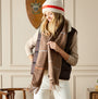 Joules LANGTREE Womens Scarf Tan Brown front view, styled with a cozy vest and hat, showcasing plaid design.