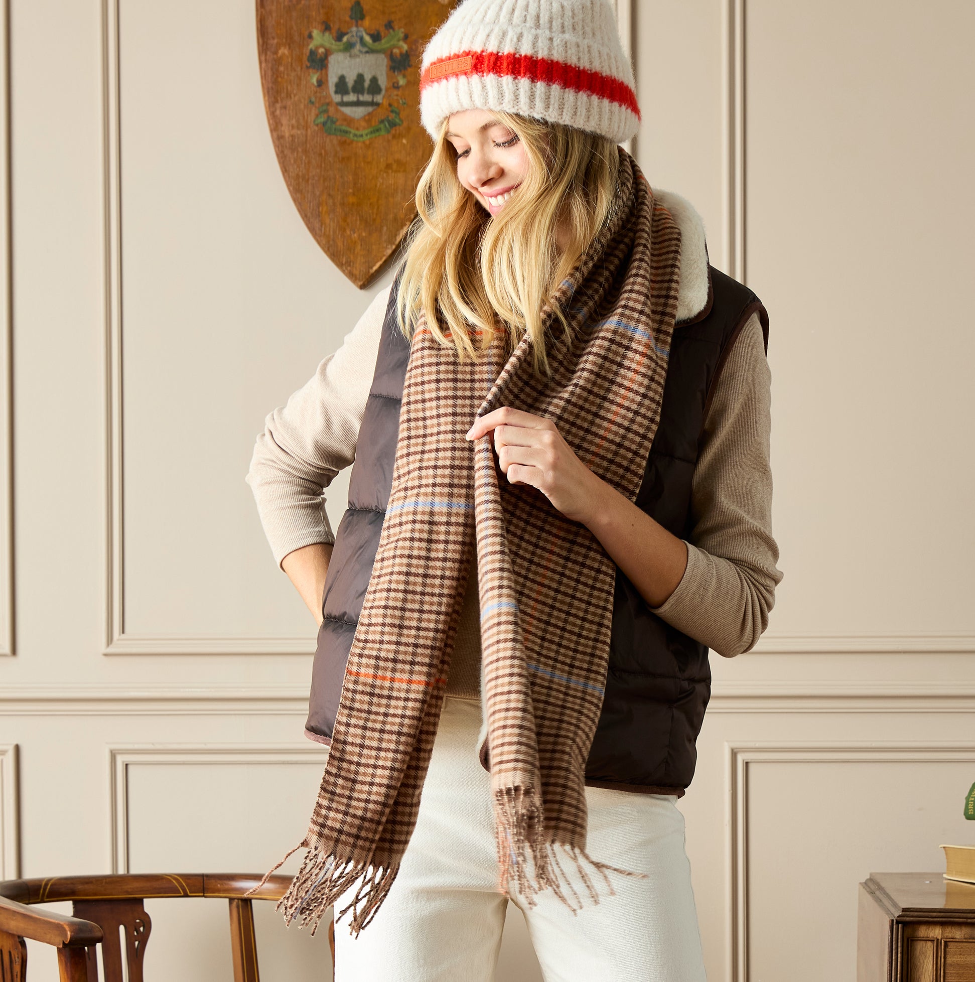 Joules LANGTREE Womens Scarf Tan Brown front view, styled with a cozy vest and hat, showcasing plaid design.