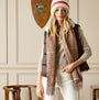 Joules LANGTREE Womens Scarf Tan Brown displayed in detail view on model with cream background and dark vest.