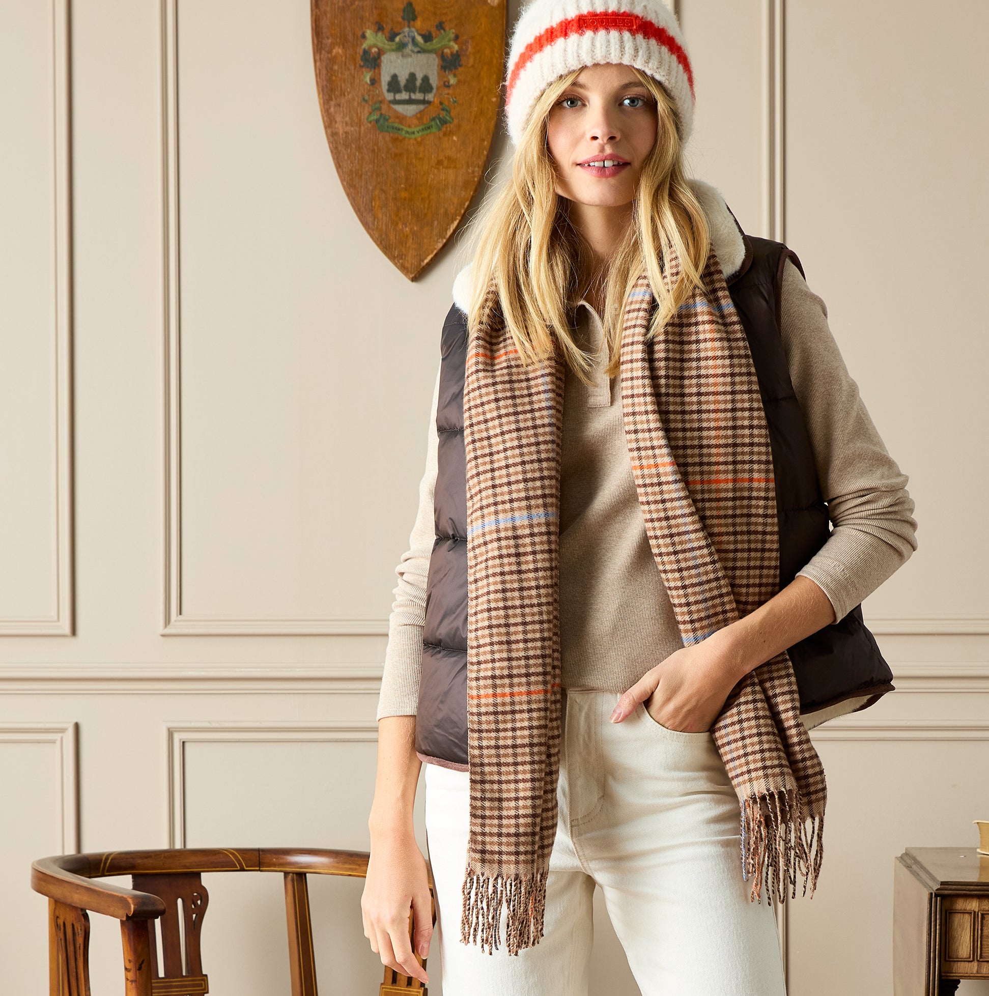 Joules LANGTREE Womens Scarf Tan Brown displayed in detail view on model with cream background and dark vest.