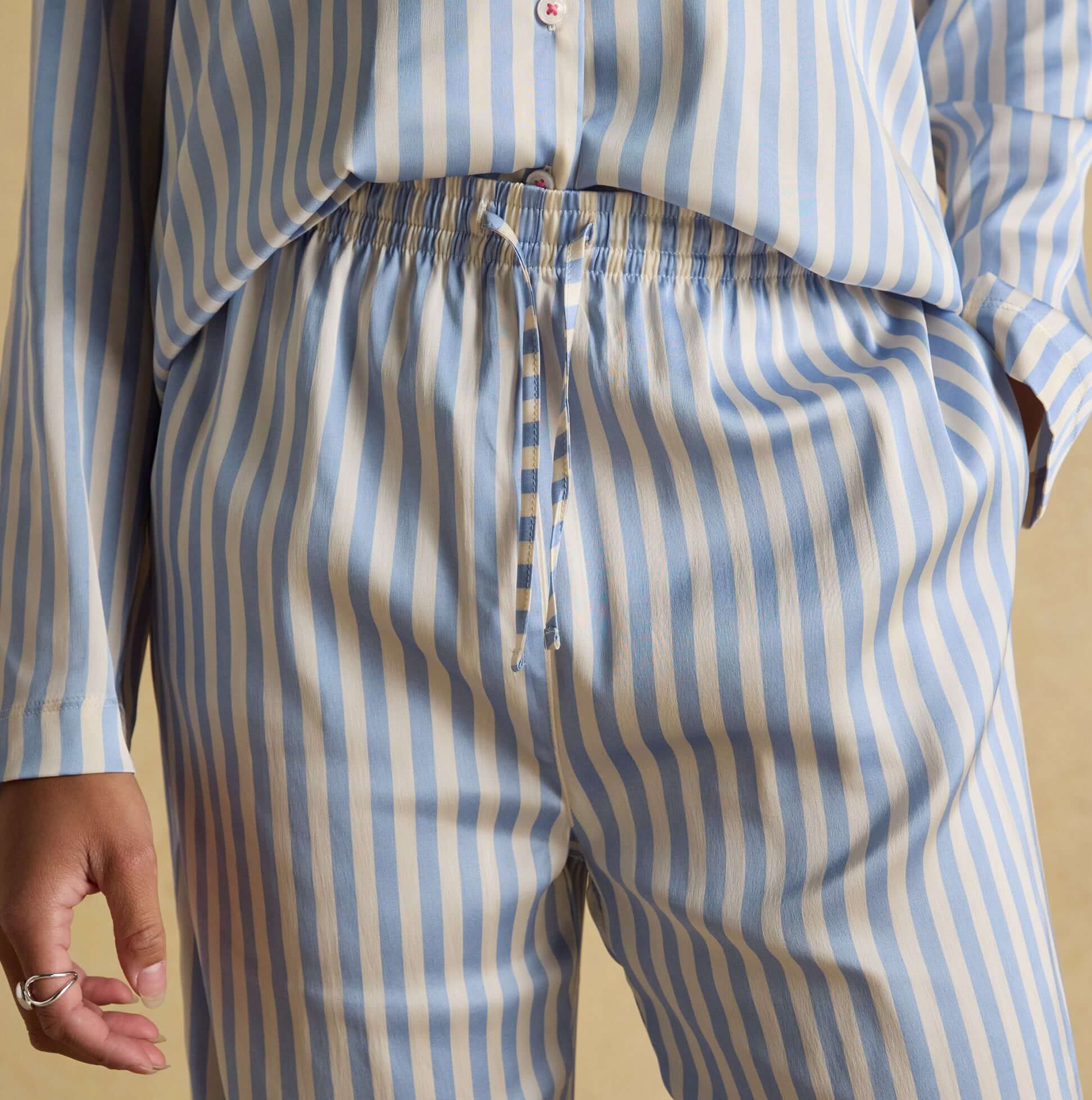 Joules BONNIE Womens Satin Pyjama Set Blue Stripe detail view showing lightweight striped fabric and elastic waistband.