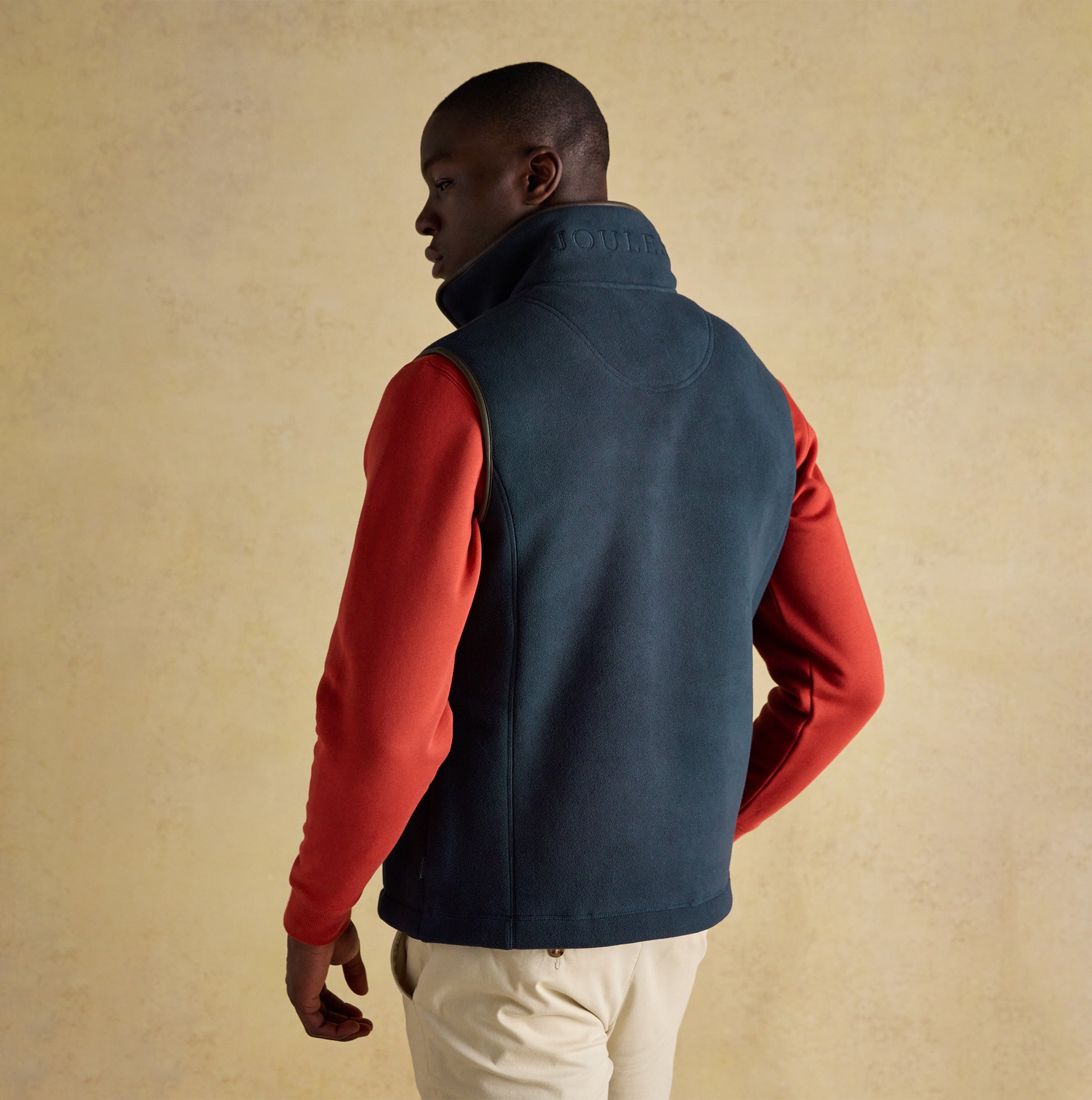 Joules HERITAGE FLEECE Mens Gilet Navy back view showcasing zip closure and sleeveless design.