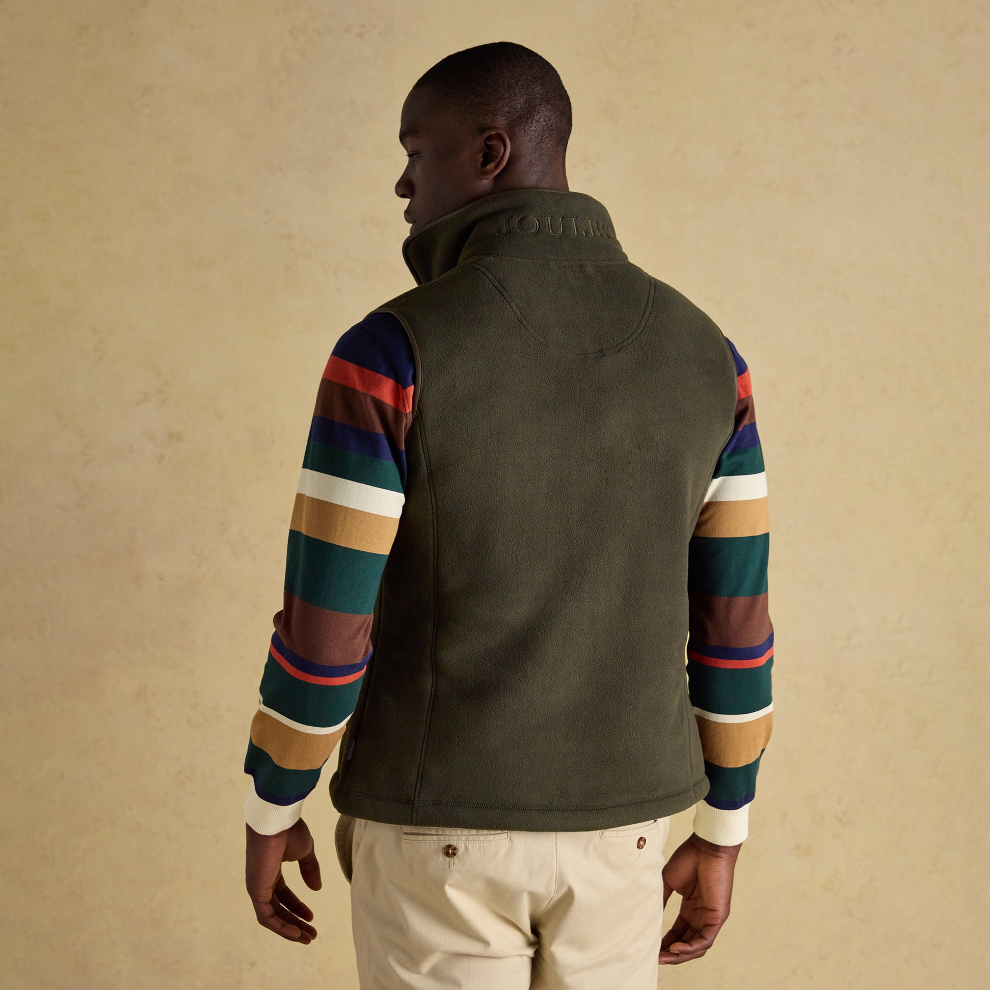 Joules HERITAGE FLEECE Mens Gilet Green back view, showcasing the sleeveless design and zip closure.
