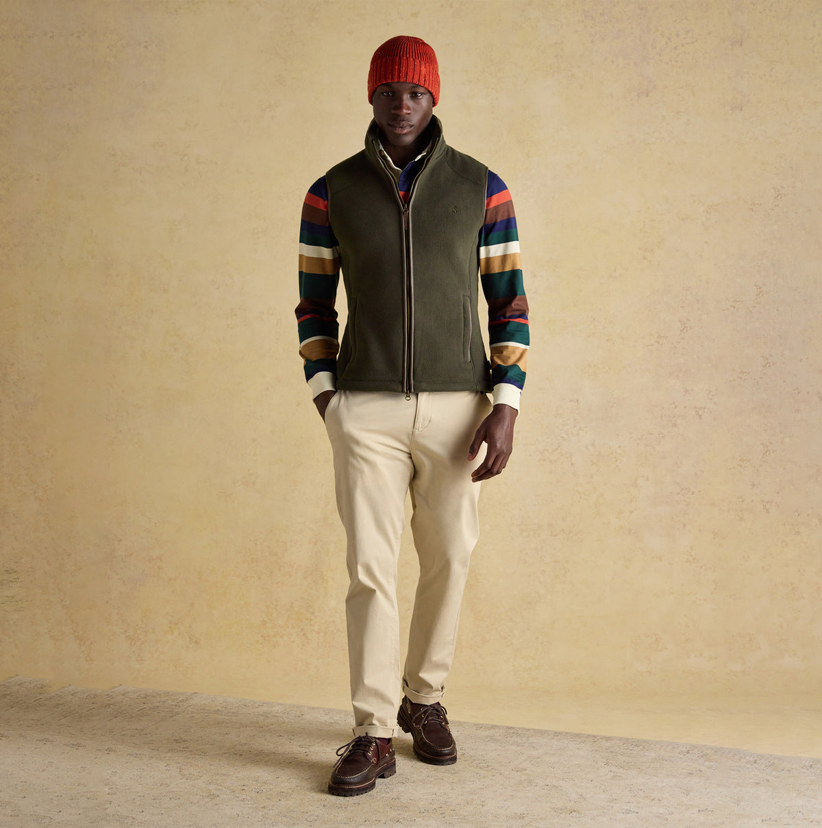 Joules HERITAGE FLEECE Mens Gilet Green front view on model with hat and striped sweater