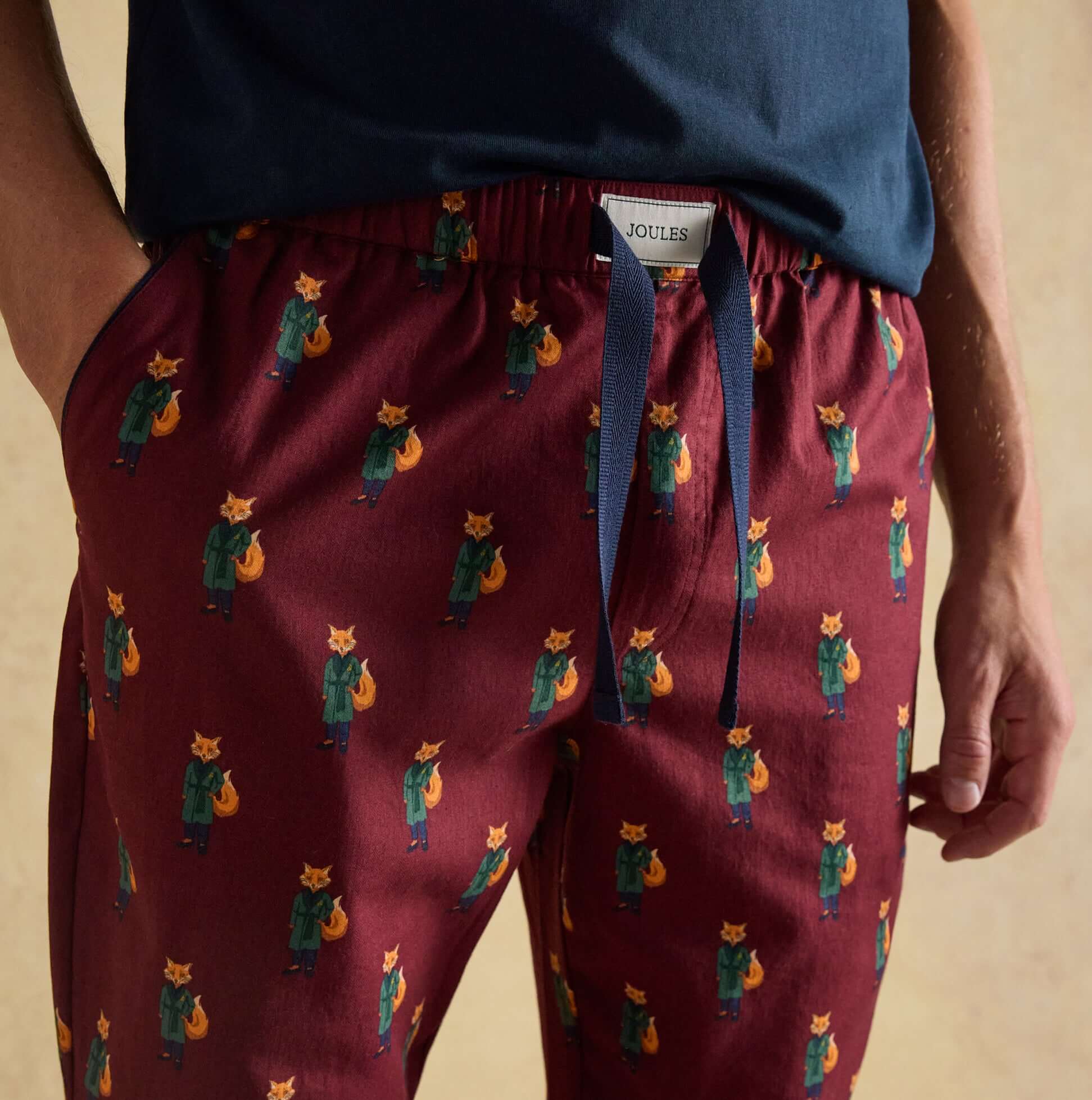 Joules DOZER Mens Pyjama Trousers Burgundy Red detail view featuring playful fox pattern and relaxed fit.