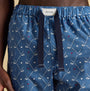 Joules DOZER Mens Pyjama Bottoms Blue close-up view showing golf pattern and elastic waistband.