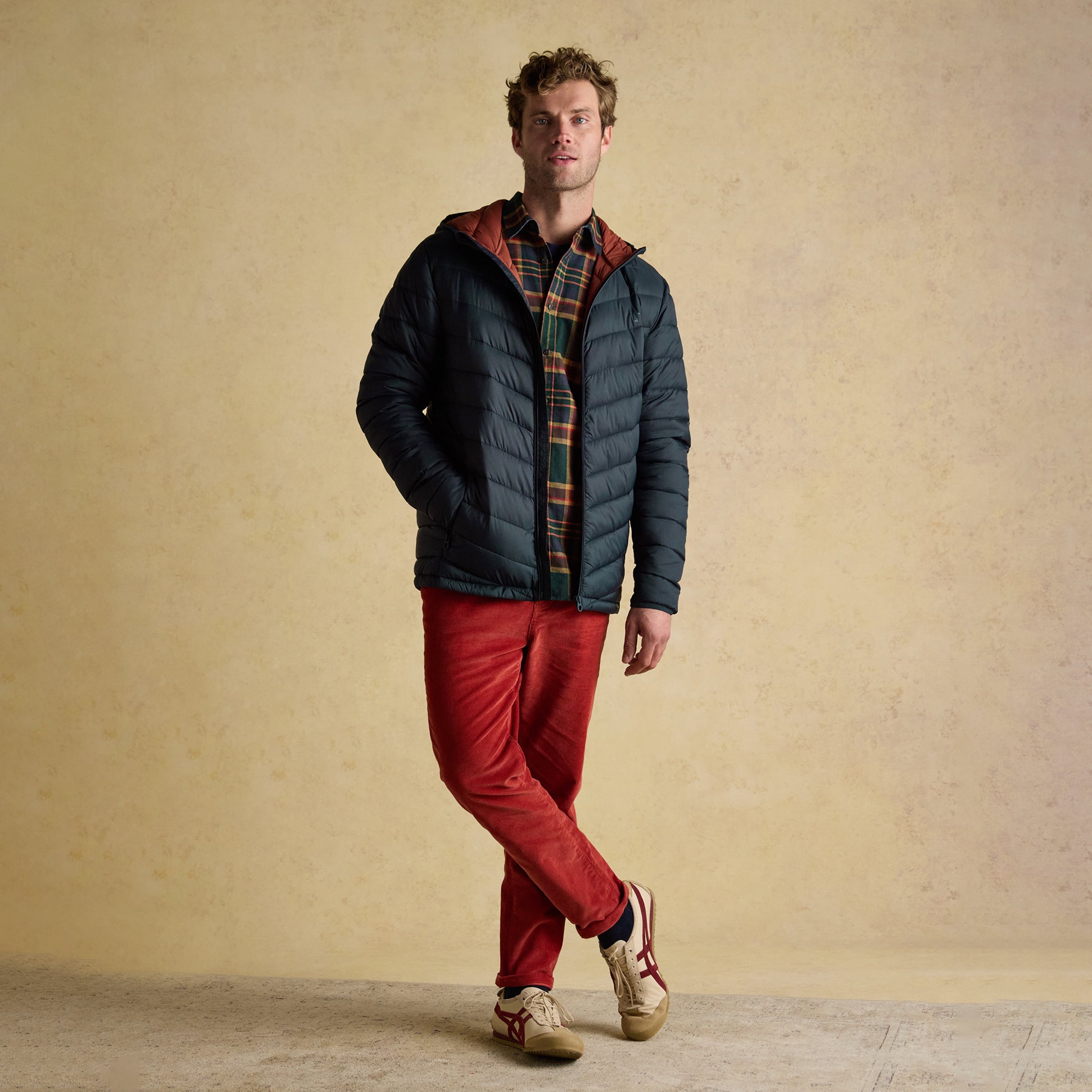 Joules GARRETT Mens Showerproof Padded Jacket Navy front view on model, featuring zip closure and long sleeves.