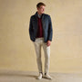 Joules MAYNARD Mens Jacket Navy front view worn by model with zip closure, paired with light trousers and white sneakers.