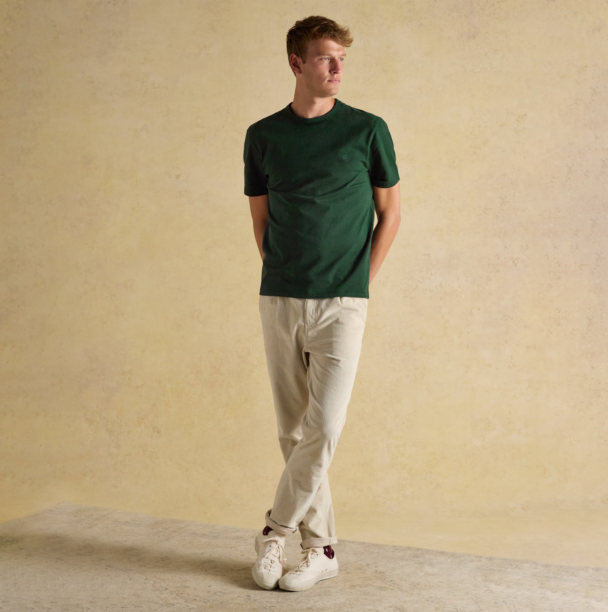 Joules RUGBY CLUB TEE Mens T-Shirt Green front view worn by model with beige pants and sneakers.