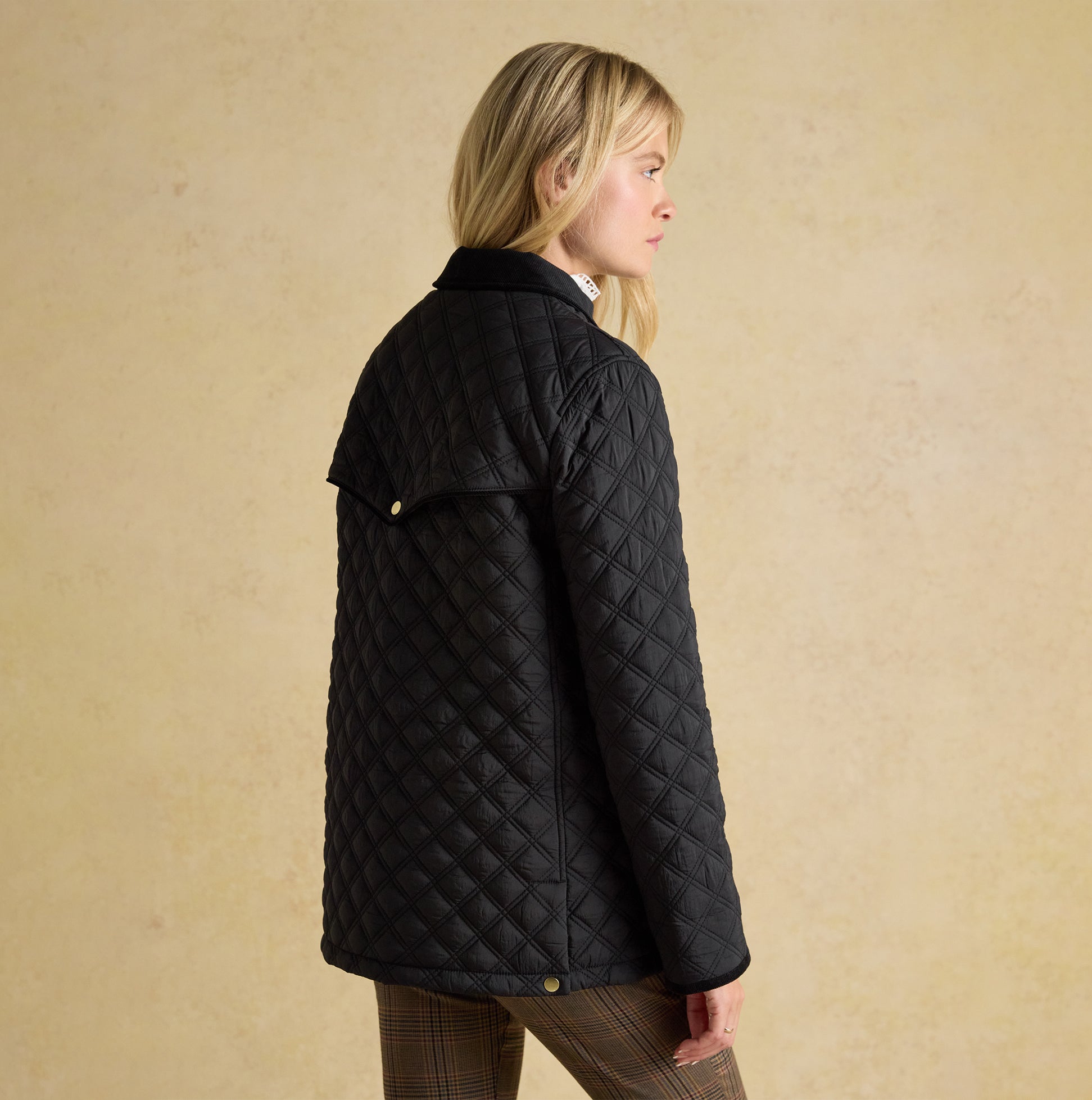 Joules BEATRIX Womens Heritage Quilted Coat Black side view showing button closure and diamond quilted pattern.
