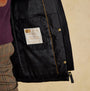 Joules BEATRIX Womens Heritage Quilted Coat Black detail view of interior lining and brand label.