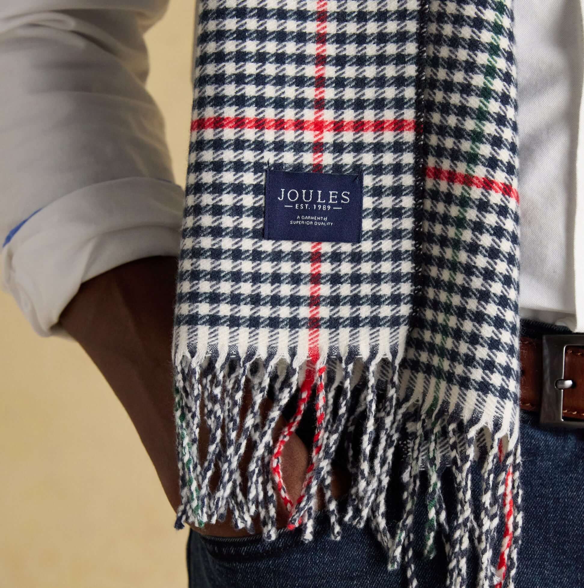 Joules LANGTREE Mens Winter Cream/Navy detail view of scarf featuring classic plaid design and joules label.