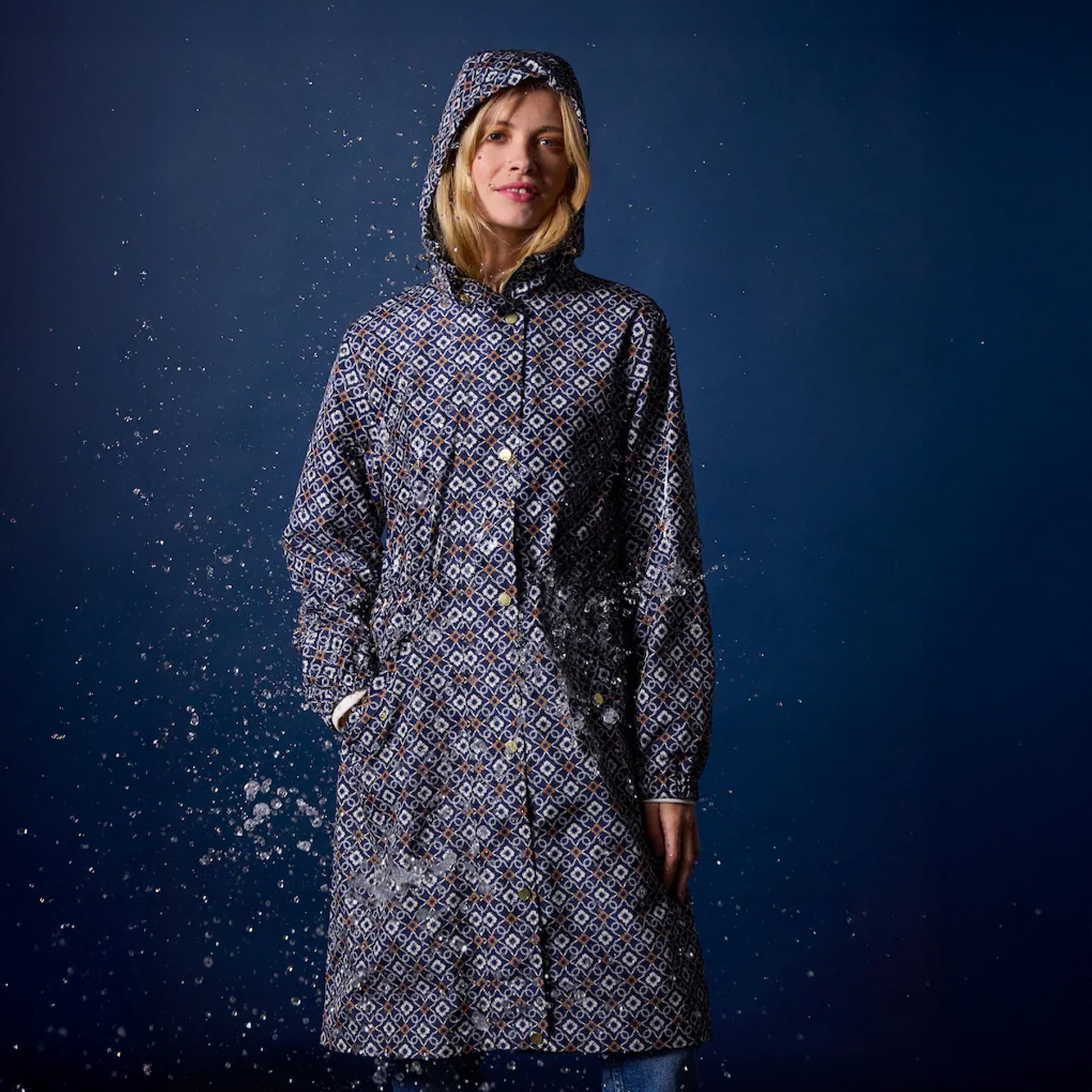 Joules Holkham Womens Waterproof Packable Raincoat With Hood Navy front view, stylish design, water-resistant fabric, and hood.