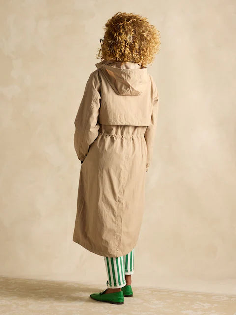 Joules Hensley Womens Waterproof Longline Coat with Packable Hood Tan Brown back view featuring adjustable waist and packable hood.