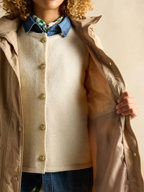 Joules Hensley Womens Waterproof Longline Coat with Packable Hood Tan Brown front view showcasing button and zip closure.