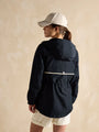 Joules Holt Waterproof Packable Raincoat with Hood Navy, back view showing hood and adjustable waist on model.