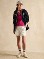 Joules Holt Waterproof Packable Raincoat with Hood Navy worn in a front view with casual outfit.