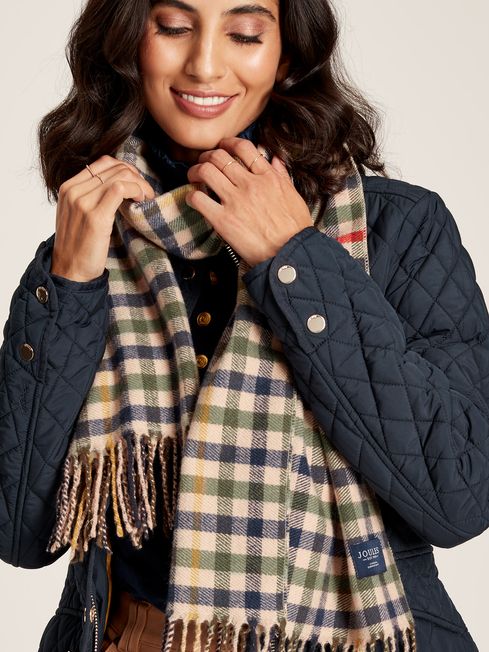 Joules LANGTREE Womens Scarf Henson Check detail view worn with jacket, showcasing woven design and tasselled ends.