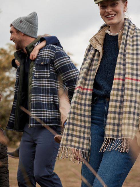 Joules LANGTREE Womens Scarf Henson Check front view with model wearing a check pattern scarf outdoors.