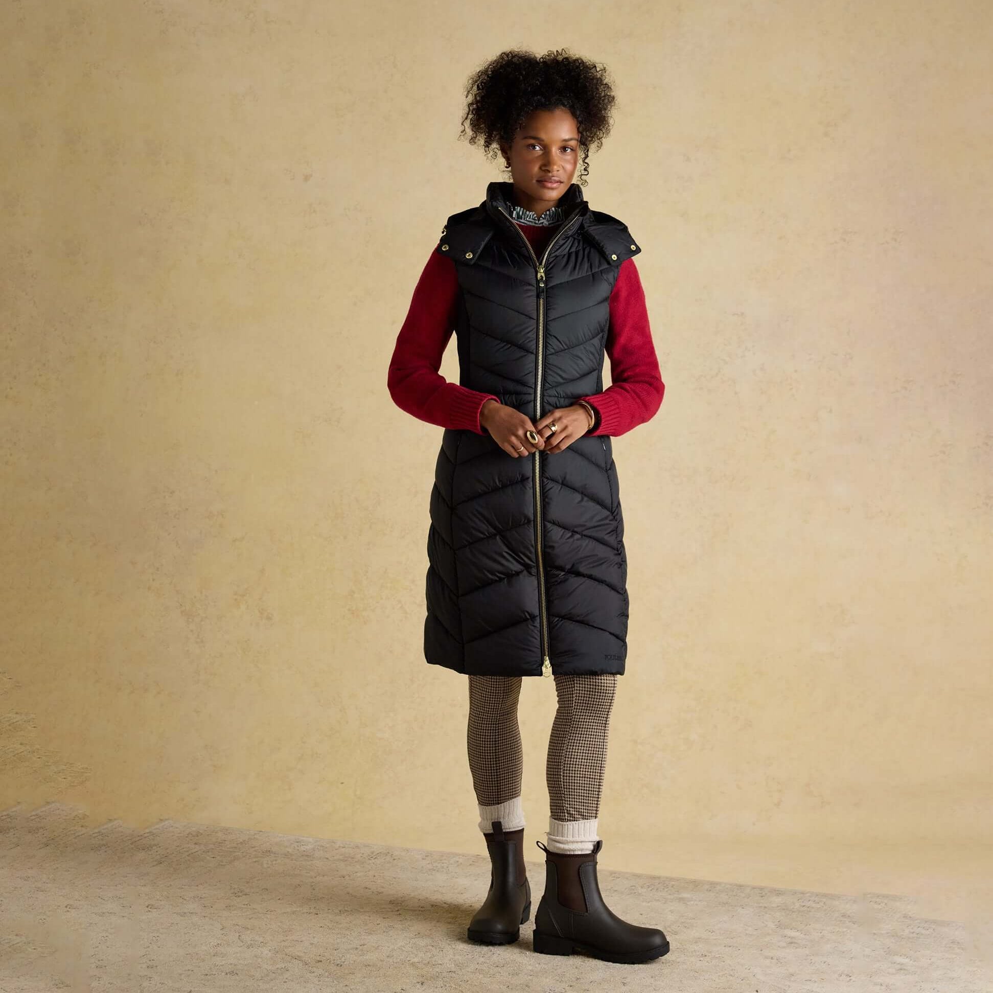 Joules PEMBURY Black Longline Showerproof Padded Gilet with Hood Black front view, showcasing the stylish design and comfortable fit.