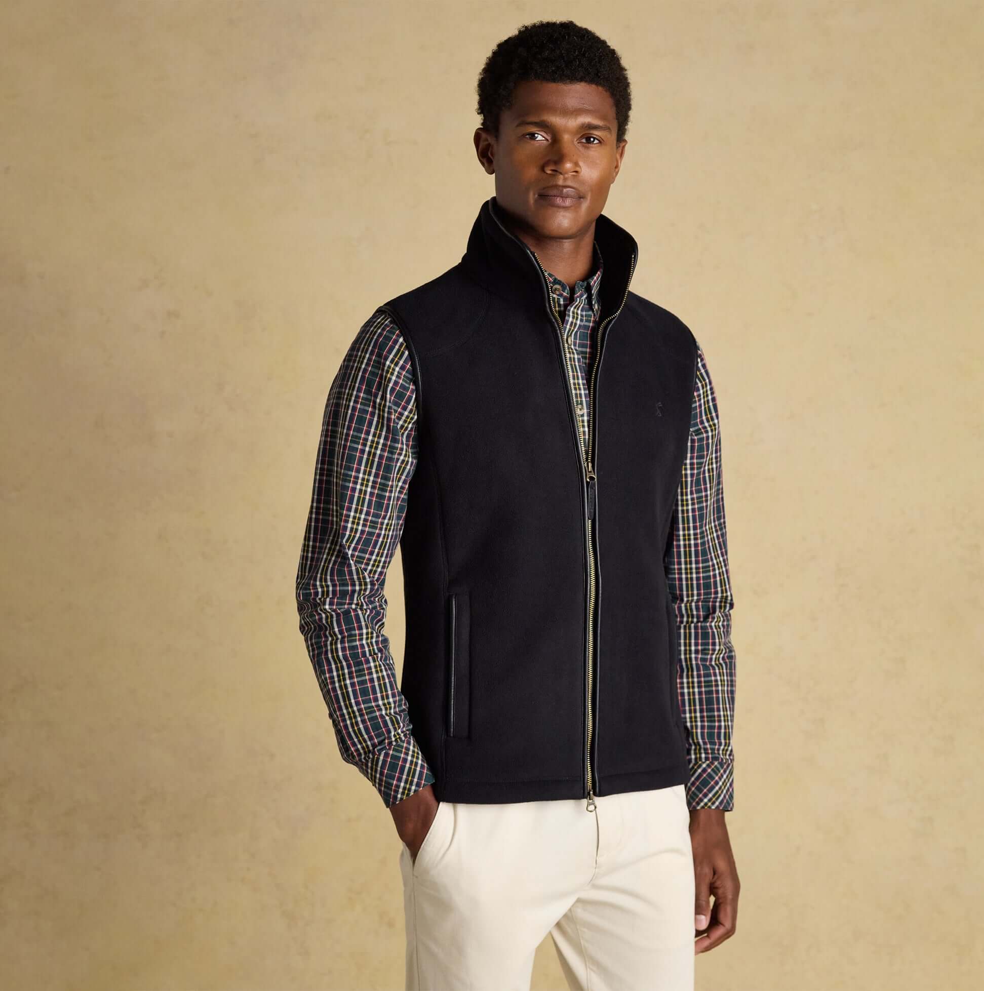 Joules HERITAGE FLEECE Mens Gilet Black front view on model, sleeveless, zip fastening, made from 100% recycled polyester.