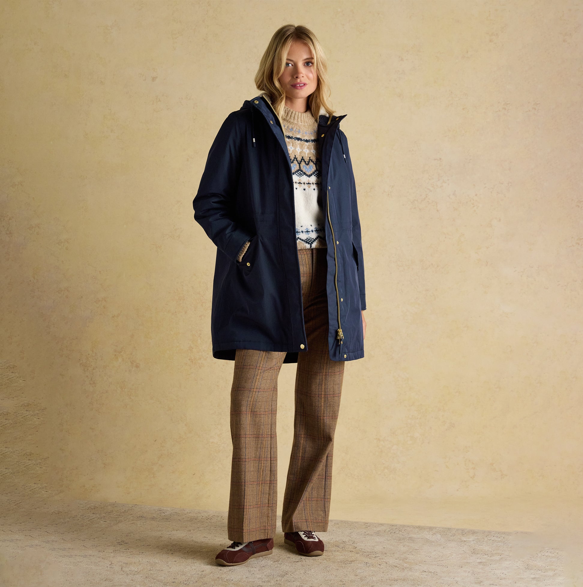 Joules PORTWELL Waterproof Hoodie Raincoat With Adjustable Waist Navy front view, model wearing navy raincoat with long sleeves.