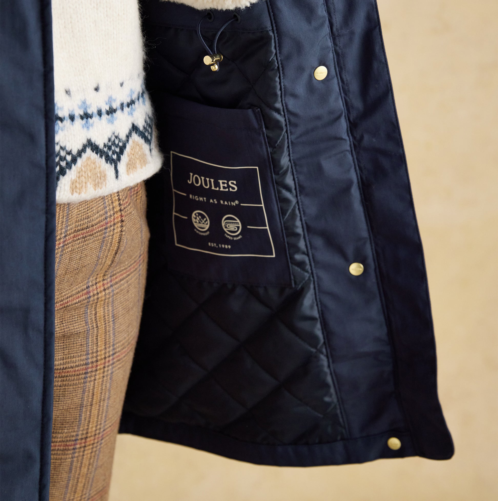 Joules PORTWELL Waterproof Hoodie Raincoat With Adjustable Waist Navy detail view showing inner lining and brand label.