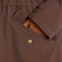Joules PORTWELL Waterproof Hoodie Raincoat With Adjustable Waist Brown detail view of pocket and button closure