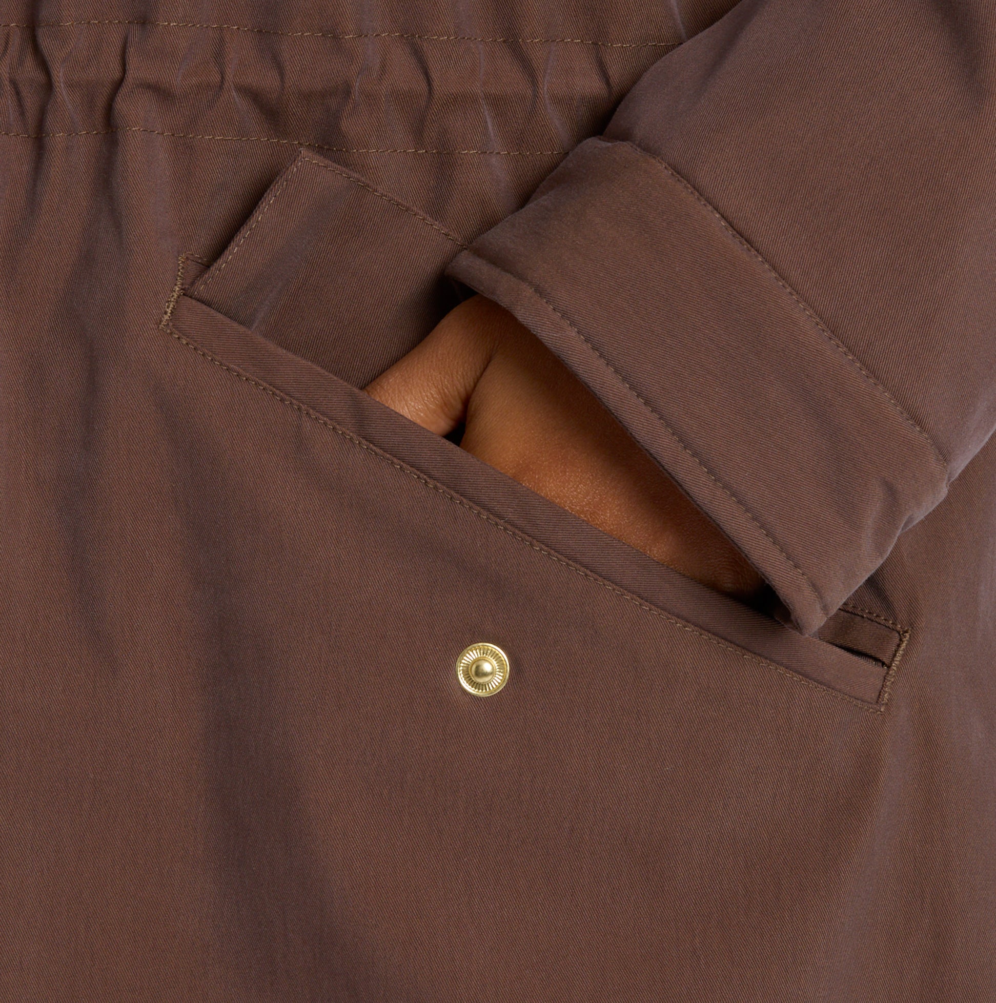 Joules PORTWELL Waterproof Hoodie Raincoat With Adjustable Waist Brown detail view of pocket and button closure