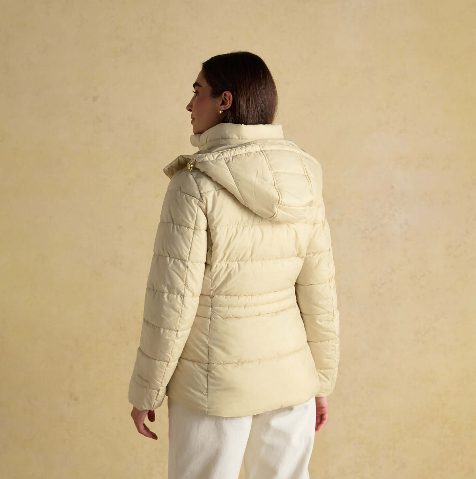 Joules HADLOW Womens Padded Short Coat Neutral back view showcasing hood and zip closure in a soft beige color.