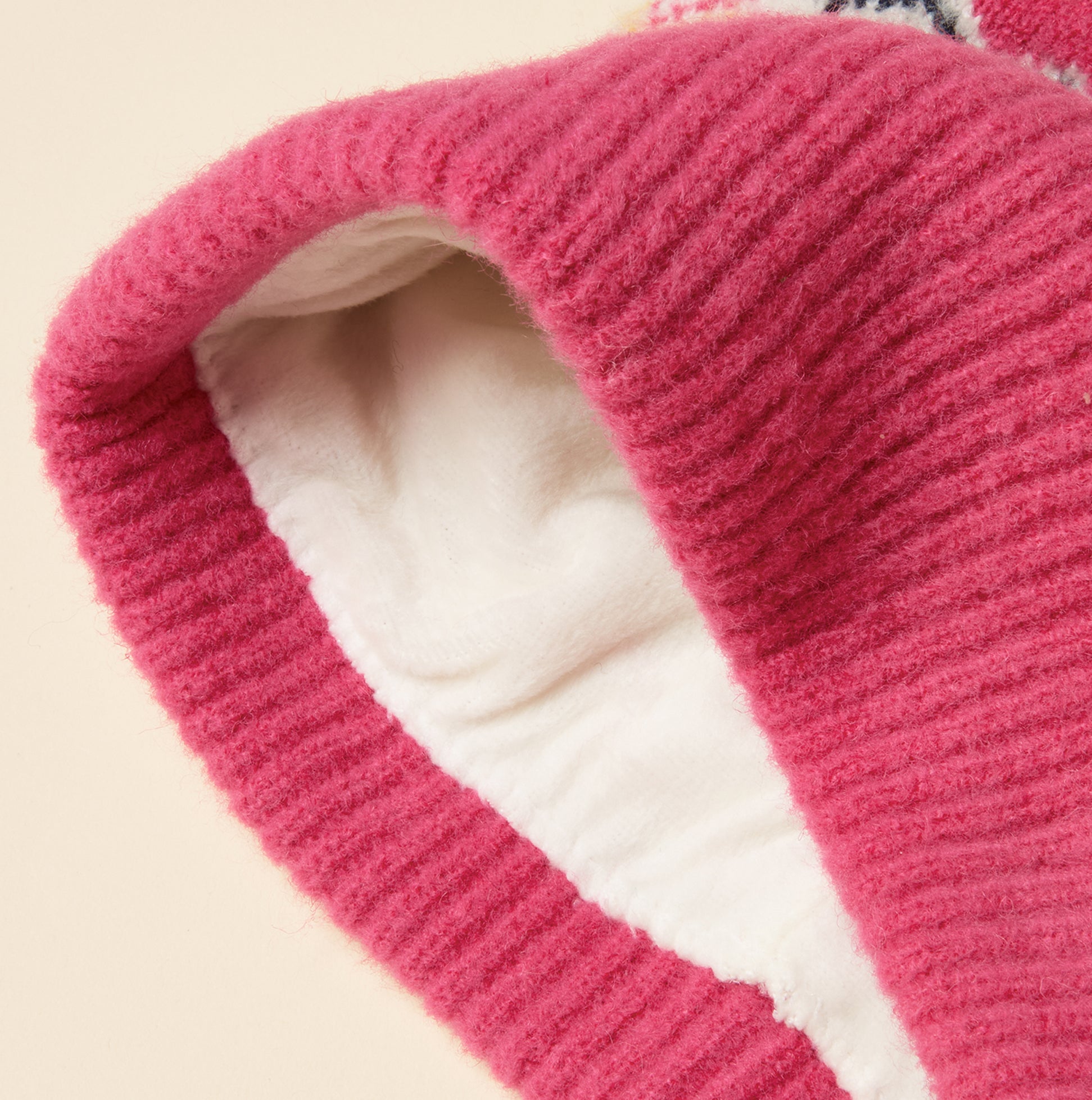 Joules KARA BOBBLE Womens Beanie Hat Pink detail view showcasing soft lining and texture.