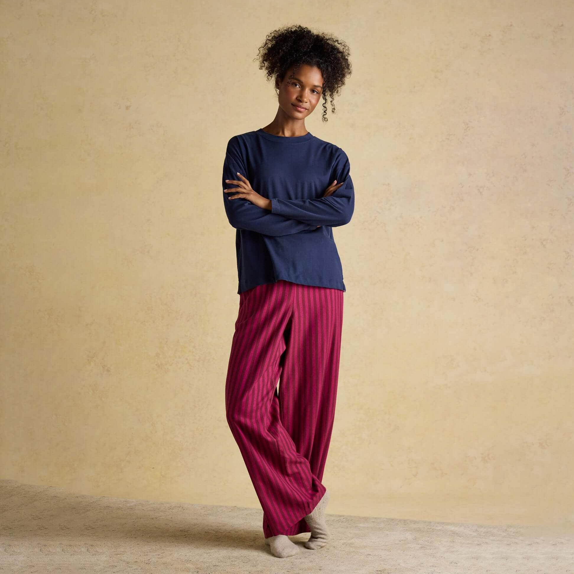 Joules JERSEY Pyjama Top Womens Sweatshirts Navy front view with model wearing paired with striped pants.