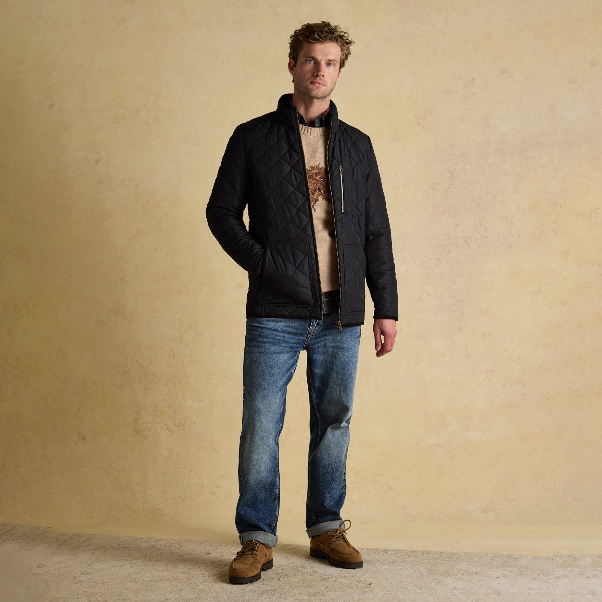 Joules MAYNARD Mens Diamond Quilted Jacket Black front view on model standing with jeans.