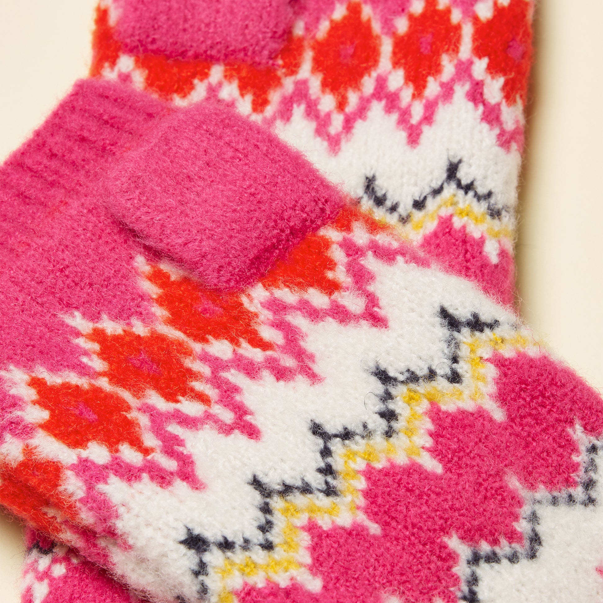 Joules KARA Fingerless Fairisle Glove Pink detail view showcasing vibrant patterns and textures.