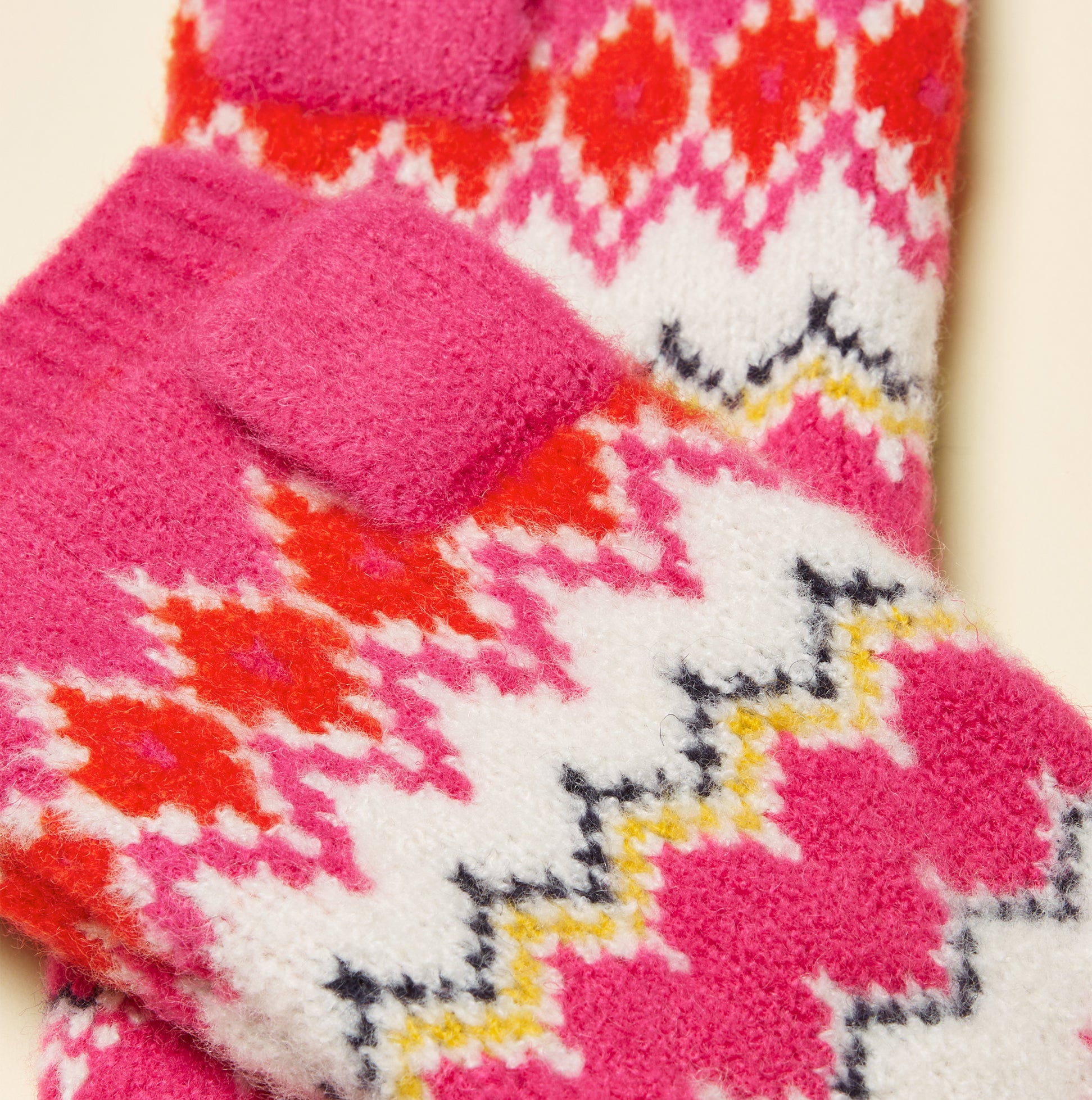 Joules KARA Fingerless Fairisle Glove Pink detail view showcasing vibrant patterns and textures.