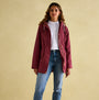 Joules PORTWELL Womens Raincoat Port front view on model, featuring adjustable hood and concealed zipper.