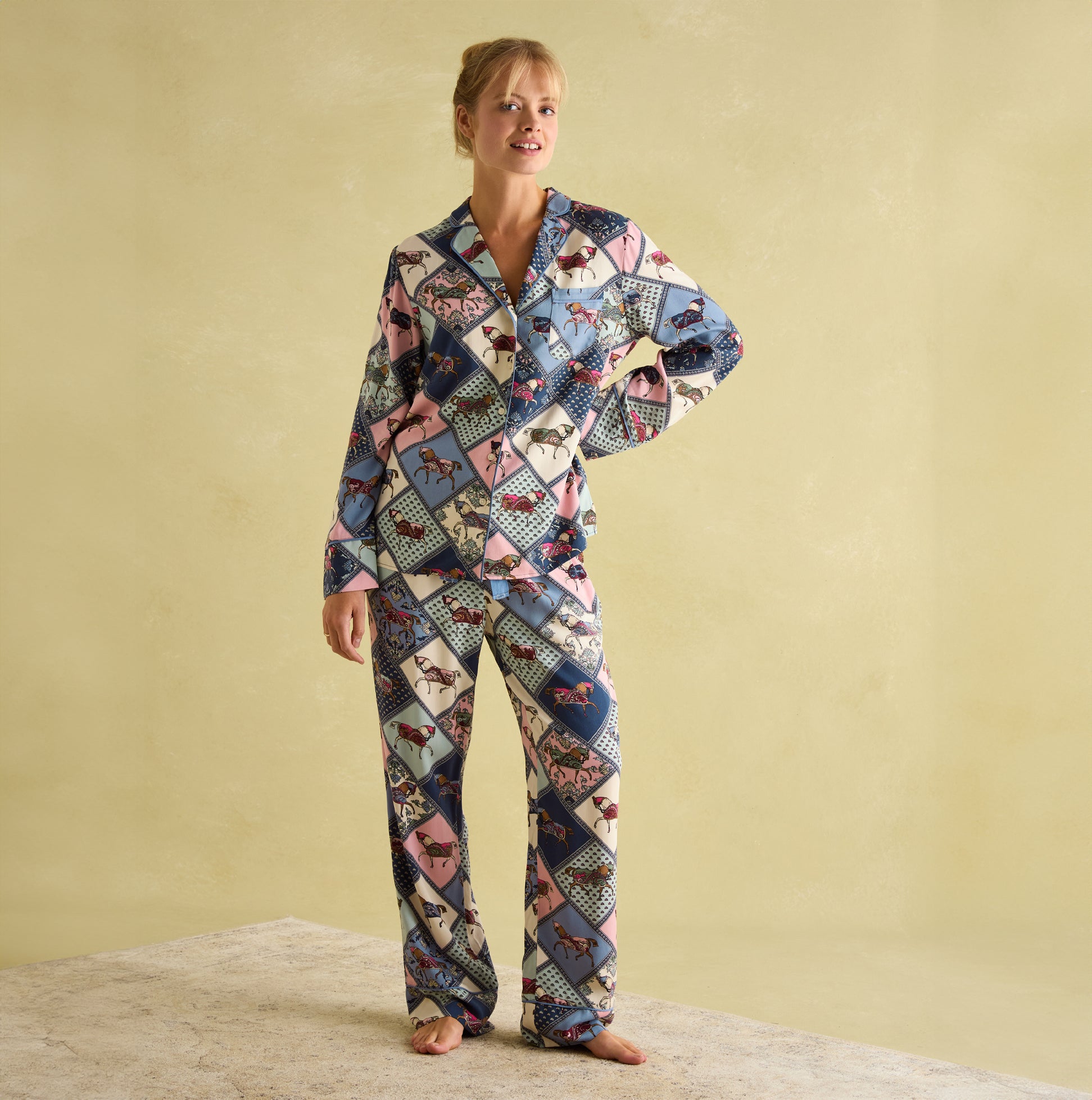 Joules ALMA Womens Pyjama Set Horse Multi displayed in a front view, featuring colorful horse patterns and a relaxed fit.
