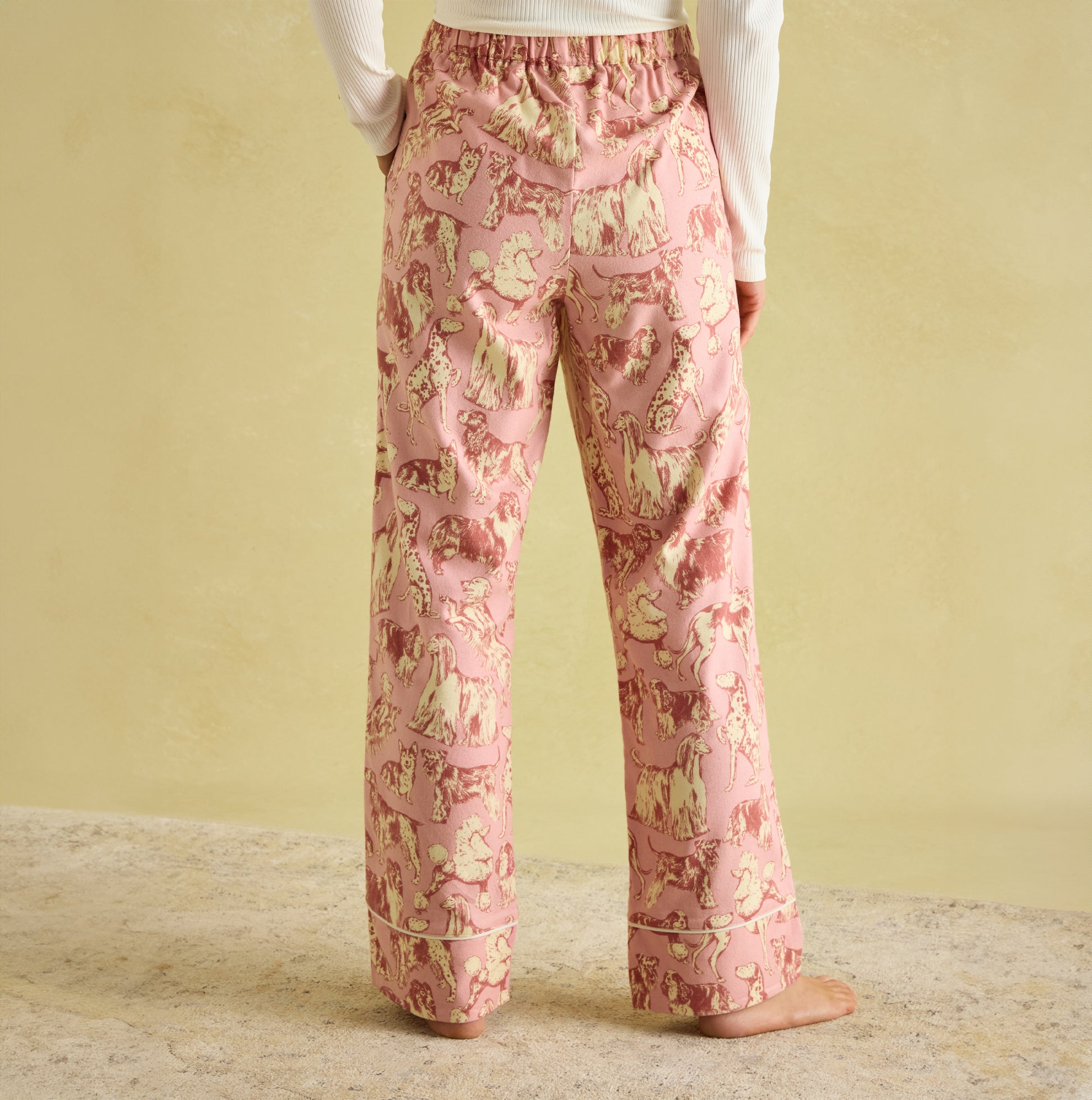Joules STELLA Womens Pyjama Bottoms Pink Dogs back view showing elasticated waist and hand-drawn dog print.