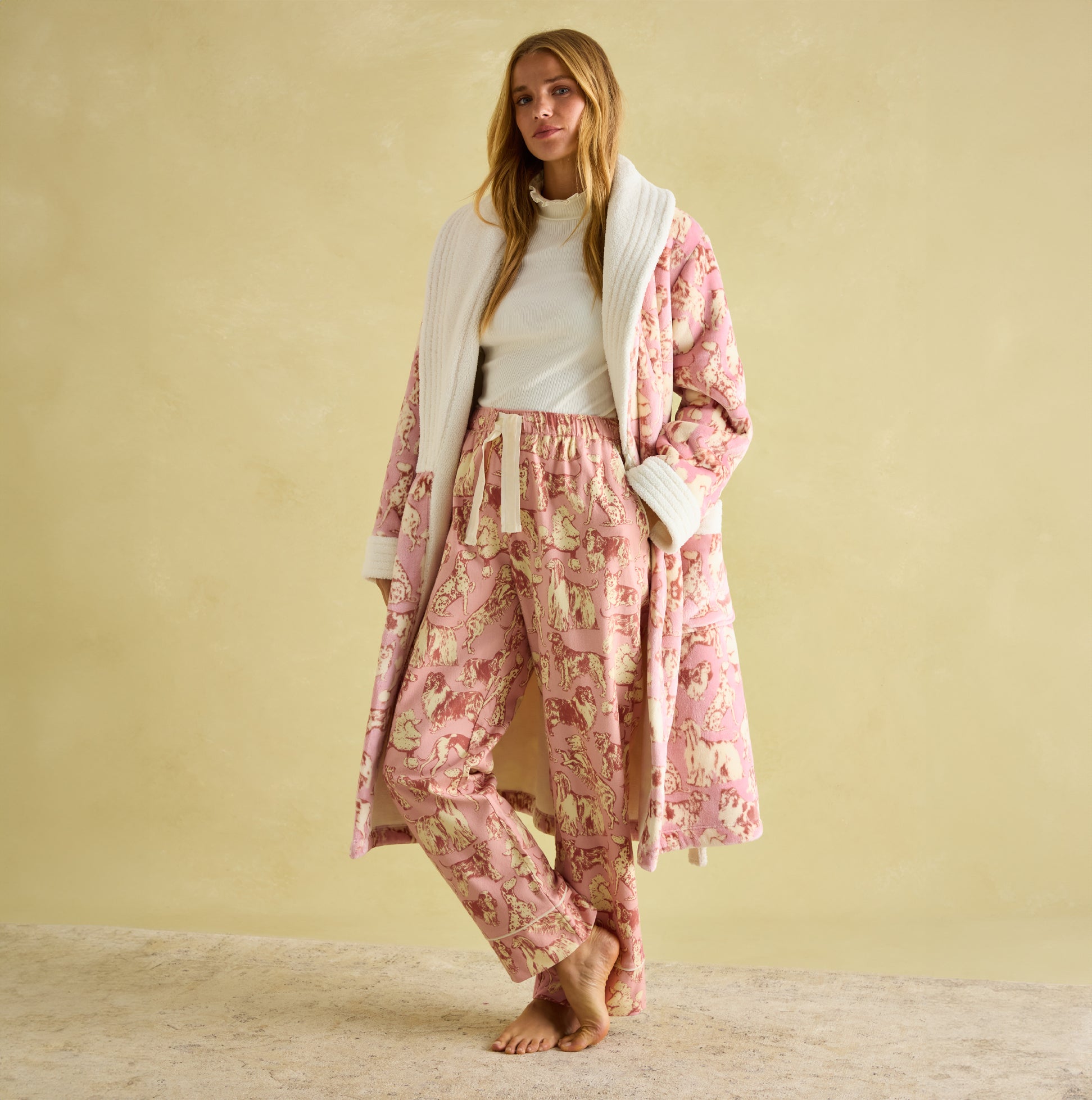 Joules STELLA Womens Pyjama Bottoms Pink Dogs front view, featuring a relaxed fit with hand-drawn dog print and elasticated waist.