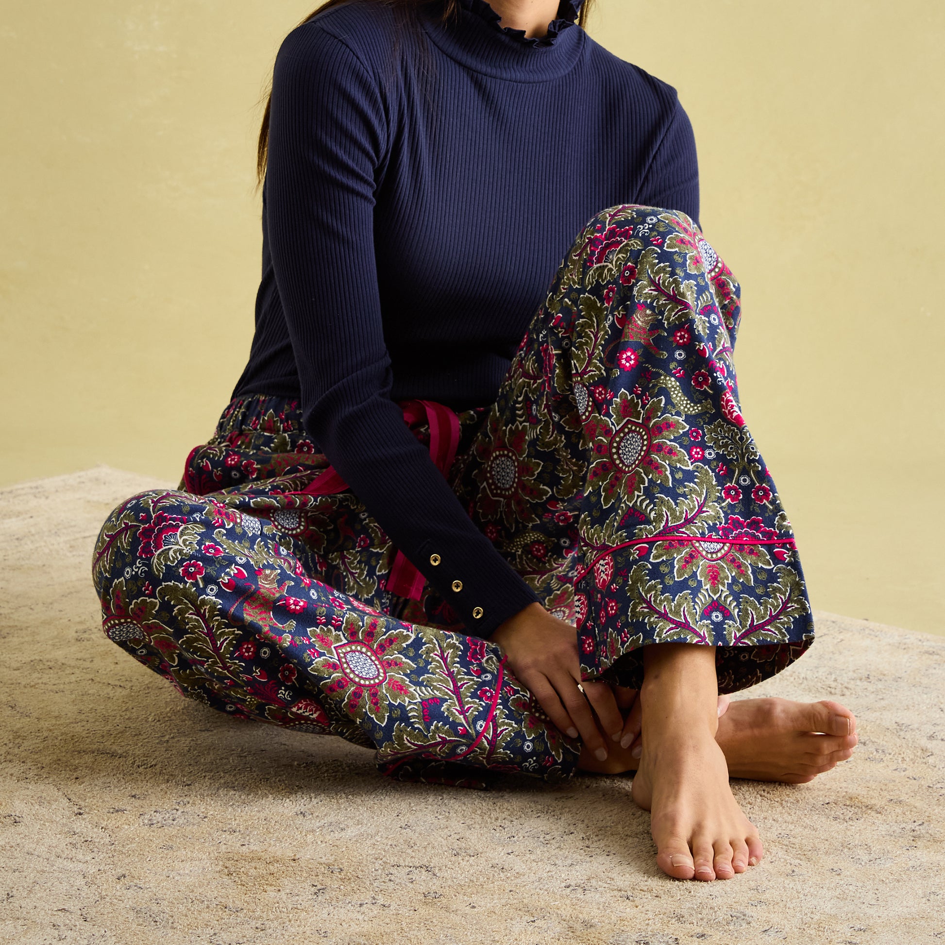 Joules STELLA Womens Pyjama Bottoms Damask side view with navy top, showcasing floral pattern and deep cuffs.